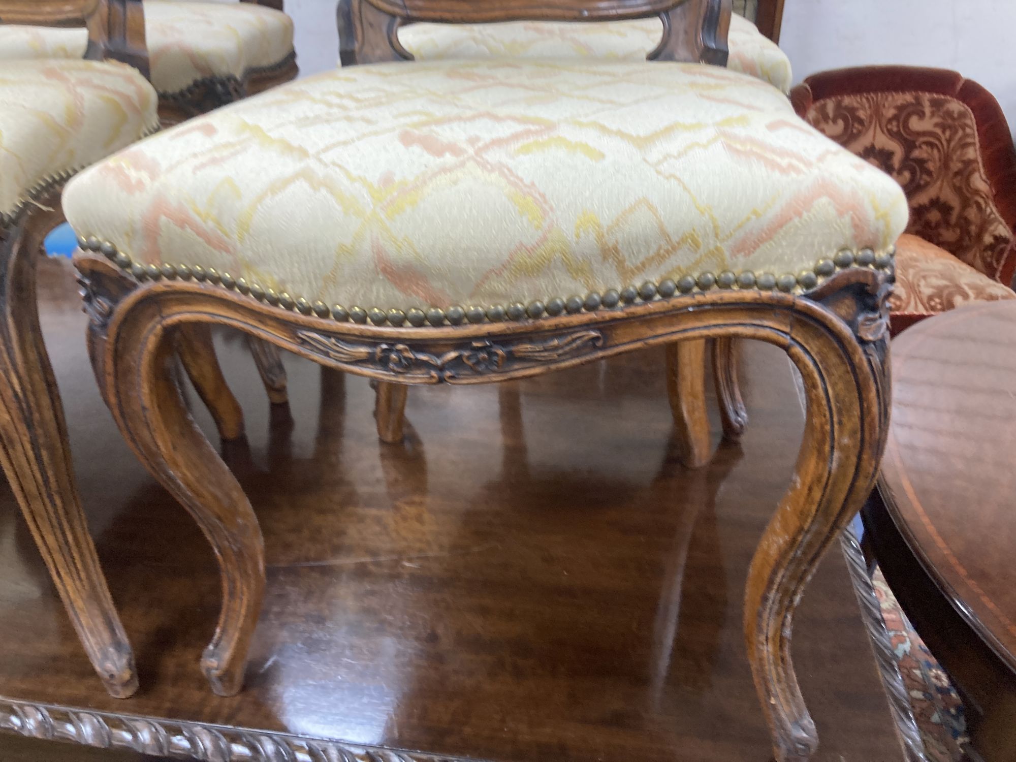 A set of six Louis XV style dining chairs, with cream and pink silk upholstery